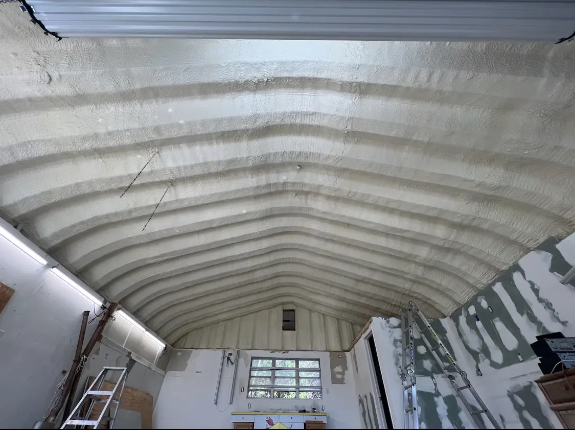 Spray polyurethane foam applied to the underside of a metal roof deck in Lincoln
